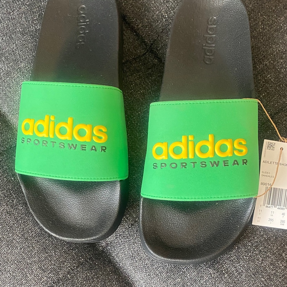 Adidas Green Slides with Yellow Logo. Brand new never worn !
